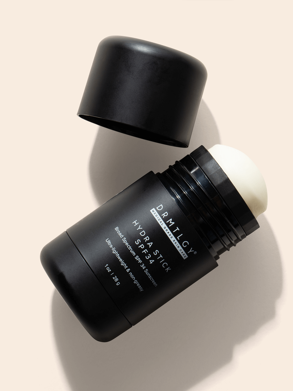 DRMTLGY Hydra Stick SPF 34 - wodoodporny sztyft przeciwsłoneczny do twarzy i ciała 28 g