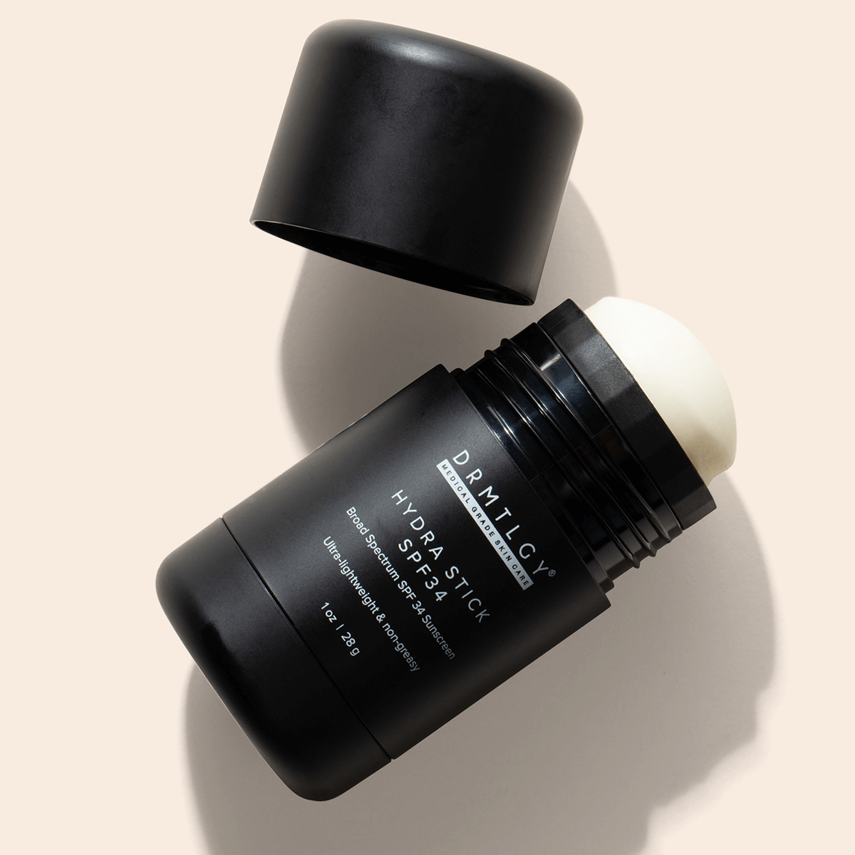 DRMTLGY Hydra Stick SPF 34 - wodoodporny sztyft przeciwsłoneczny do twarzy i ciała 28 g