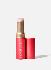 Peach & Lily Glass Skin Luminizing Stick - rozświetlacz w sztyfcie z balsamową teksturą 10 g
