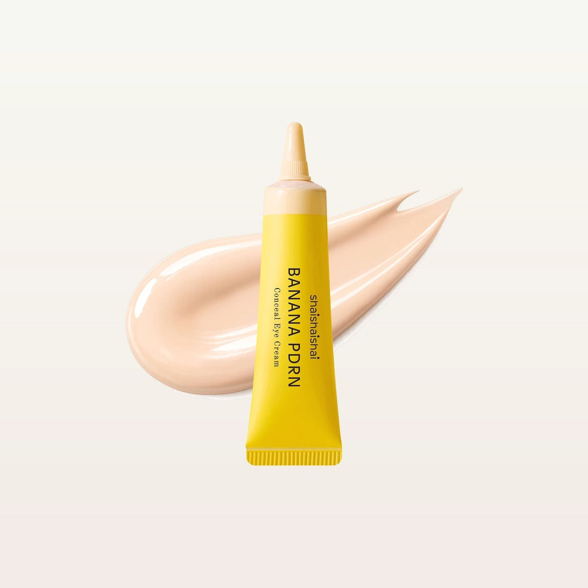 Shaishaishai Banana PDRN Conceal Eye Cream, odcień Cream - żółta tuba z jasną beżową końcówką i smuga jasnego kremu | Ellemania