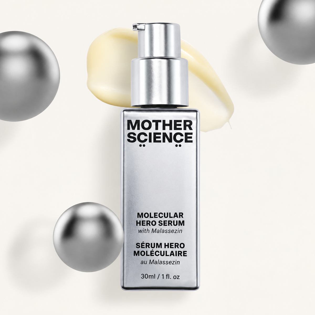 Mother Science Molecular Hero Serum 30 ml - butelka z pompką na tle kremowej smugi i srebrnych kul | Ellemania