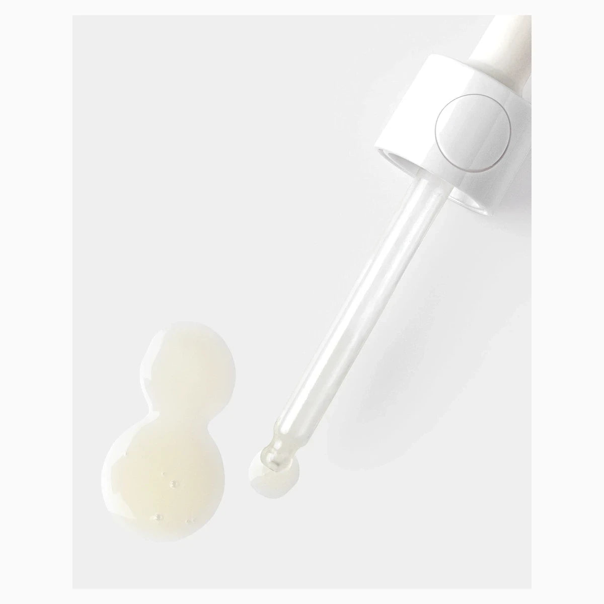 AMEON Aurora Glow Serum 30 ml, zbliżenie na pipetę i kroplę serum | Ellemania