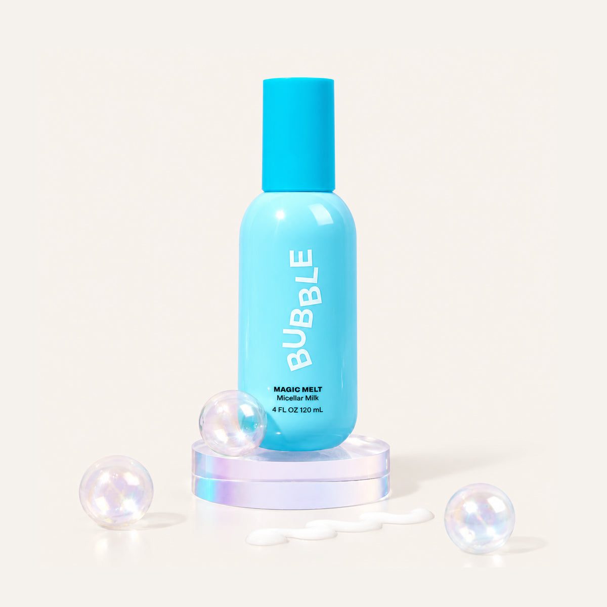 Bubble Magic Melt Micellar Milk 120 ml, light blue bottle on a transparent stand among glass bubbles and product swatches | Ellemania