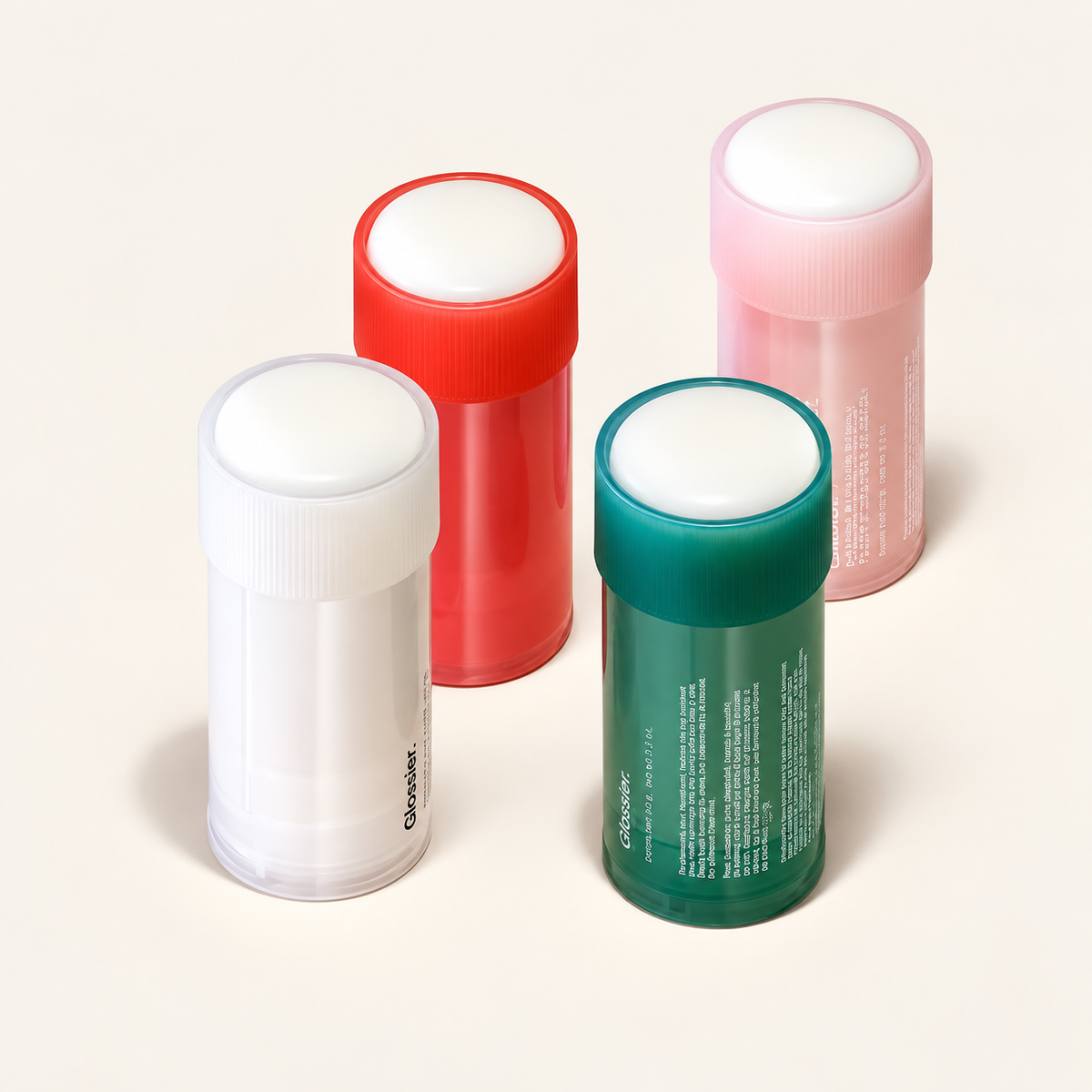 Glossier Deodorant - cztery wymienne wkłady w przezroczystych obudowach: białym, czerwonym, różowym i zielonym | Ellemania