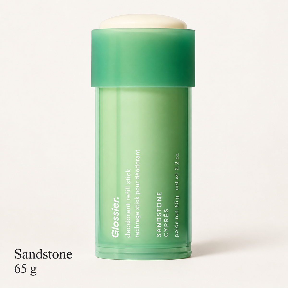Glossier Deodorant Refill Stick - zapach Sandstone, zielony wkład w sztyfcie z napisem Sandstone Cyprès i 65 g na jasnym tle | Ellemania