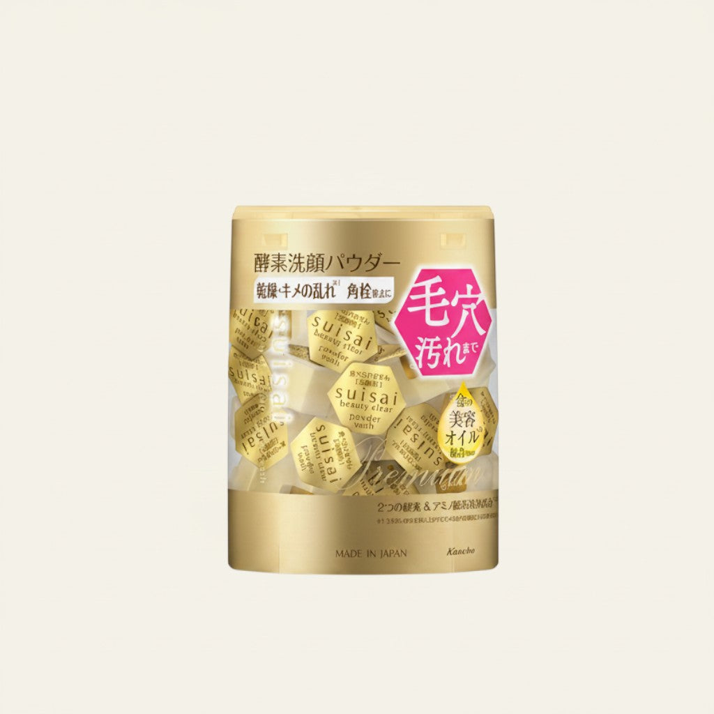 Opakowanie ellemania Kanebo Suisai Beauty Clear Gold z enzymatycznym pudrem do mycia twarzy w złotych kapsułkach.