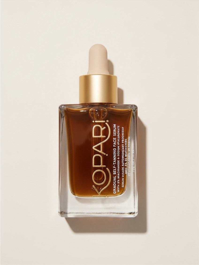 Kopari Gradual Self-Tanning Face Serum z niacynamidem w szklanej butelce z pipetą, dostępny w sklepie ellemania