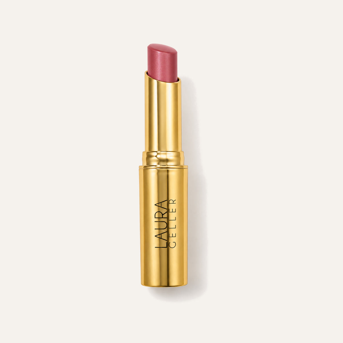 Laura Geller Jelly Balm Hydrating Lip Color, gold stick with the pink balm extended | Ellemania