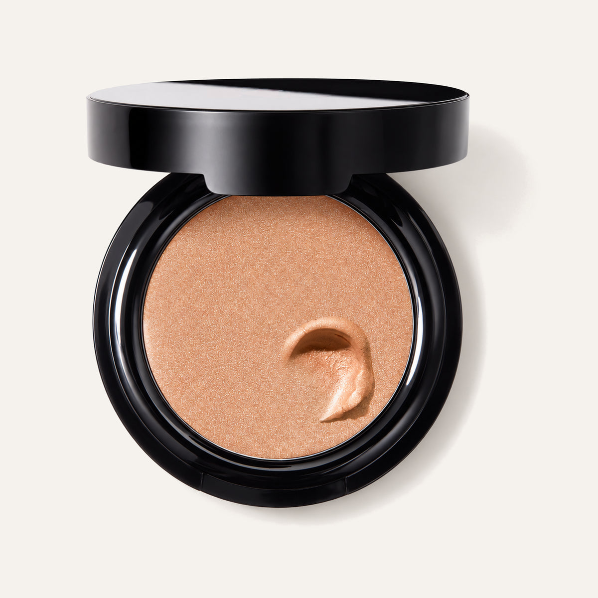 Laura Geller The Wonder Balm, open black compact with balm, viewed from above | Ellemania