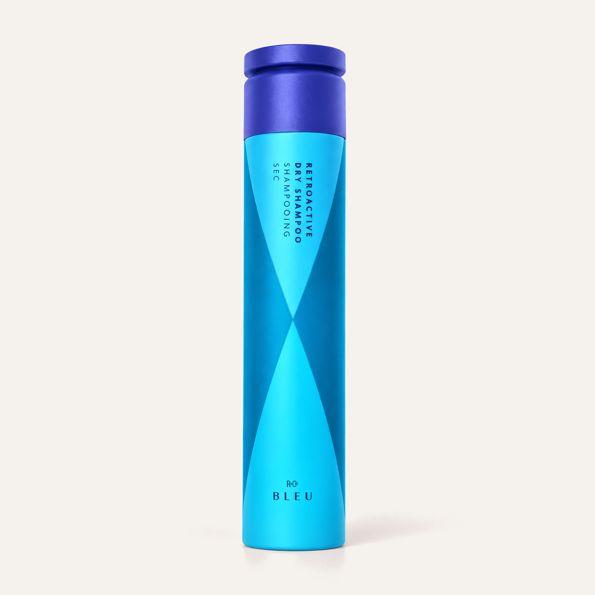 R+Co Bleu Retroactive Dry Shampoo 192 ml, niebieska butelka z aerozolem, opakowanie z przodu | Ellemania