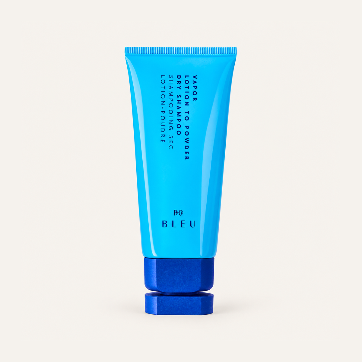 R+Co Bleu Vapor Lotion To Powder Dry Shampoo 89 ml, light blue tube with a blue cap, front view | Ellemania