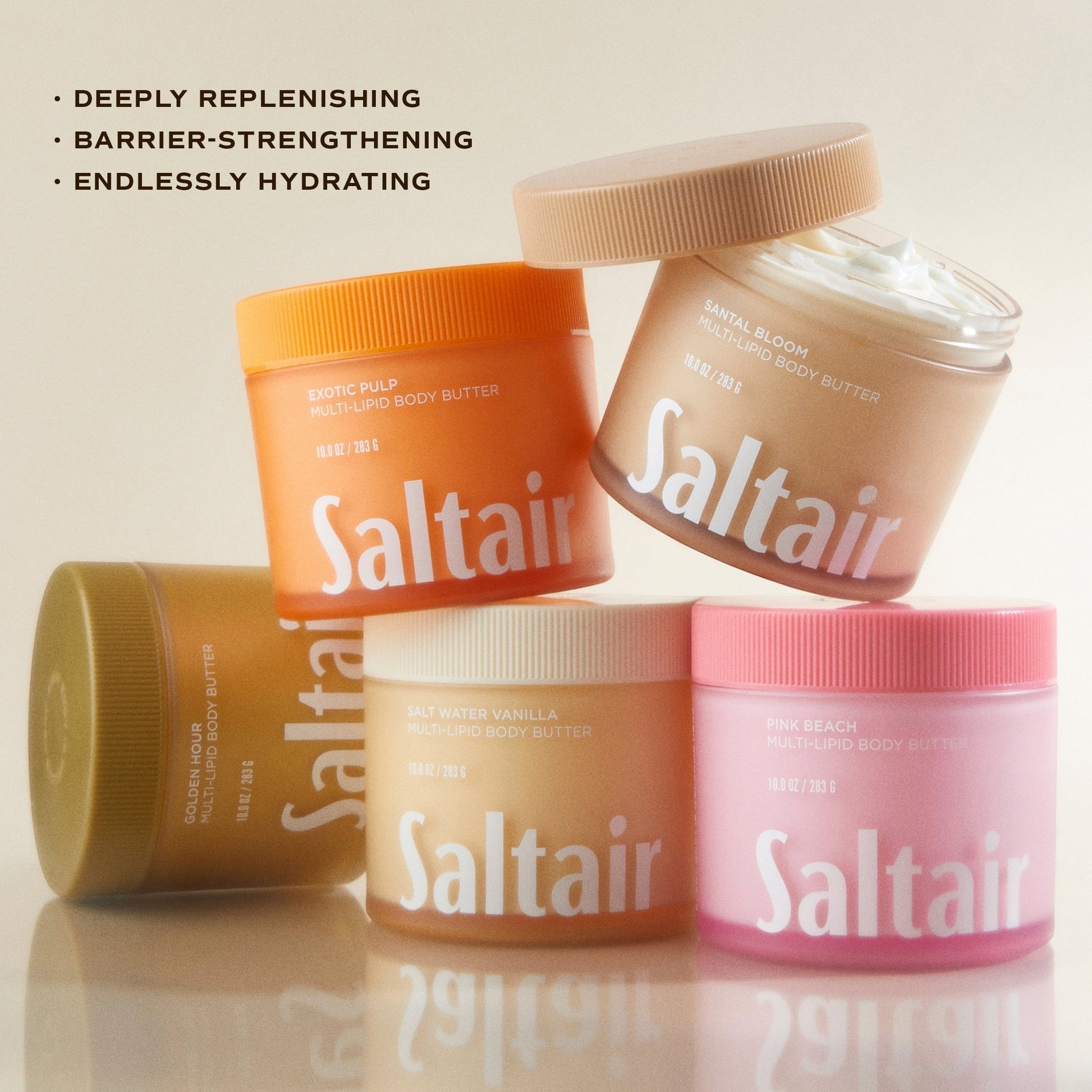 Zestaw kolorowych słoiczków masła do ciała Saltair Multi-Lipid Body Butter od ellemania na jasnym tle