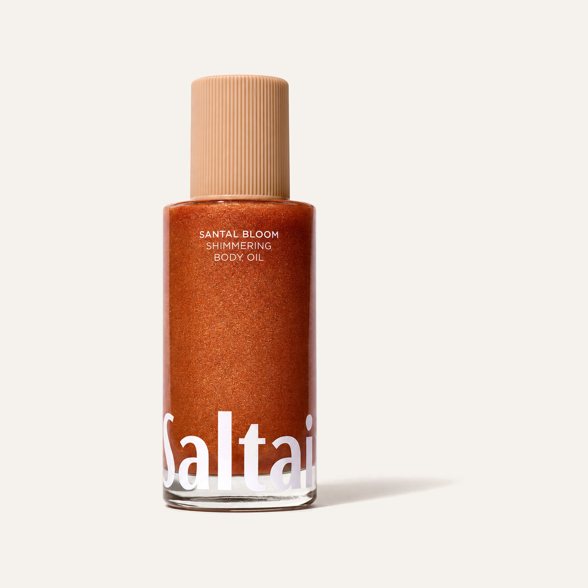 Saltair Santal Bloom Shimmering Body Oil 118 ml, butelka z pomarańczowym olejkiem z przodu | Ellemania