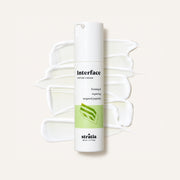 Stratia Interface Peptide Cream 50 ml, white tube with a pump against a background of cream smears | Ellemania