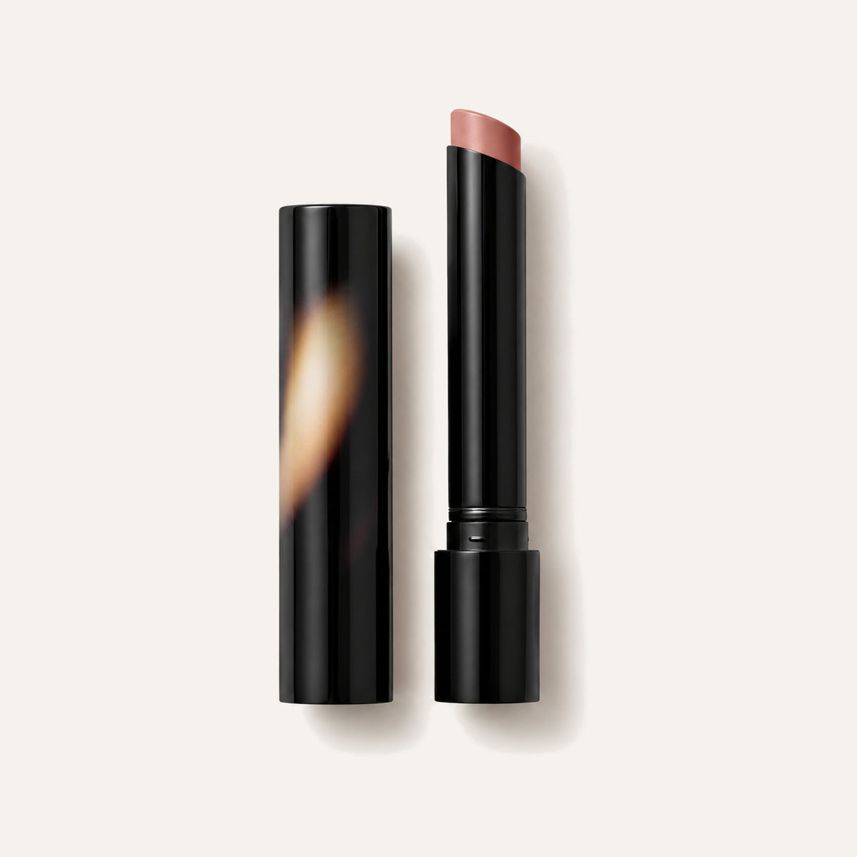 Victoria Beckham Beauty Posh Lipstick, open lipstick with a black cap next to it | Ellemania