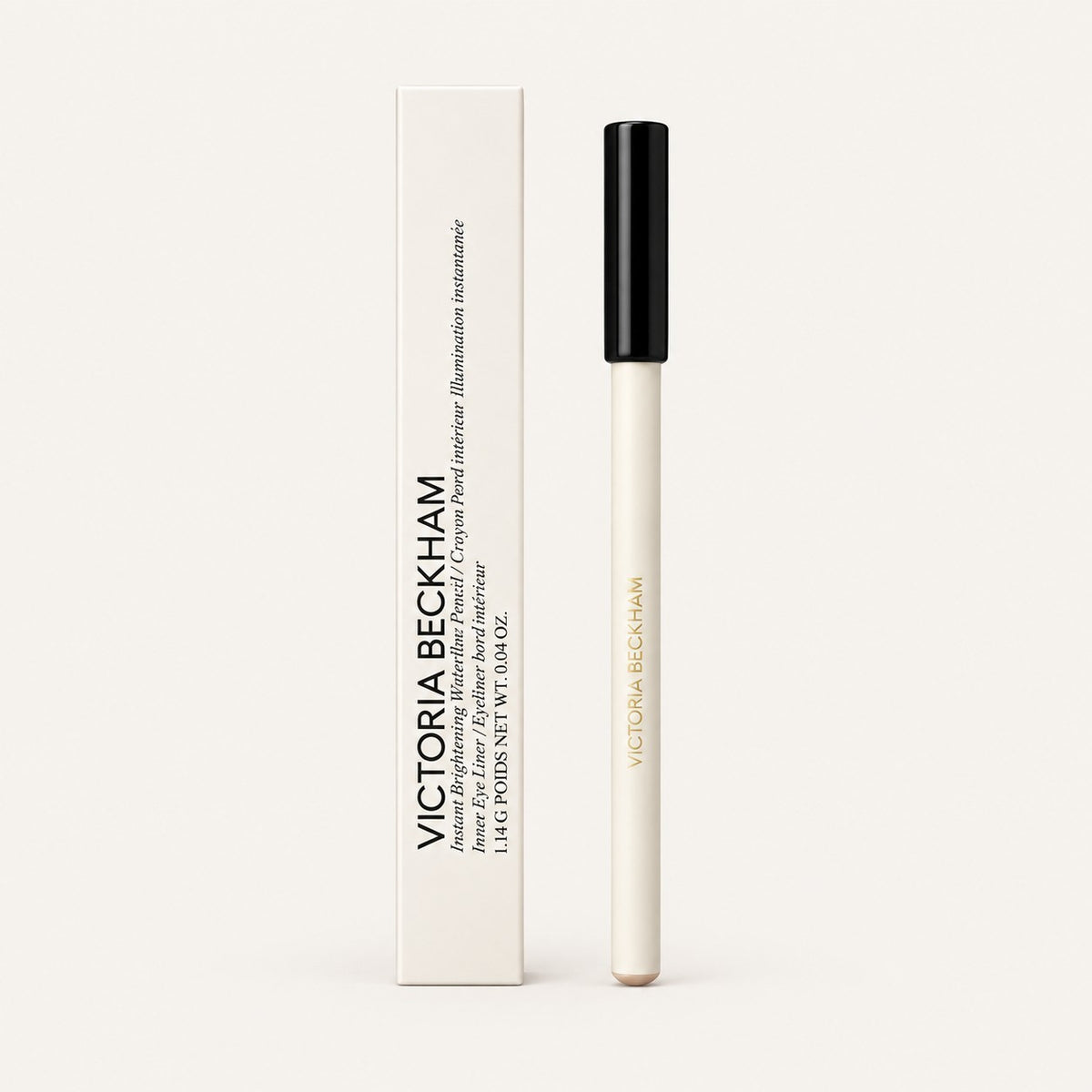 Victoria Beckham Beauty Instant Brightening Waterline Pencil - kredka z czarną zatyczką obok papierowego pudełka | Ellemania