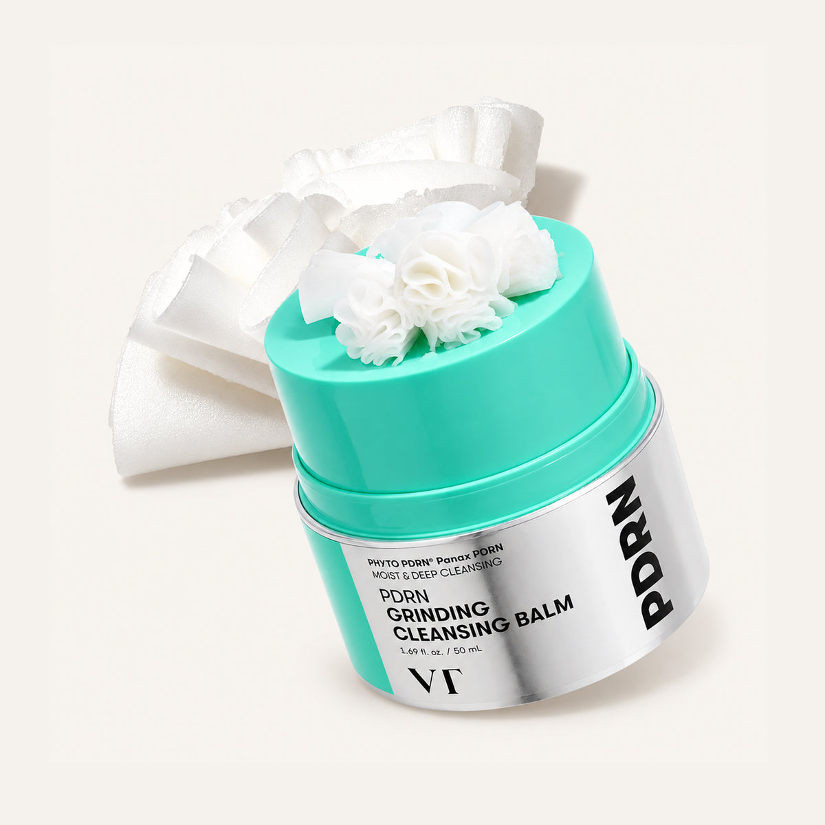 VT Cosmetics PDRN Grinding Cleansing Balm 50 ml, open jar with a turquoise lid and an applicator | Ellemania