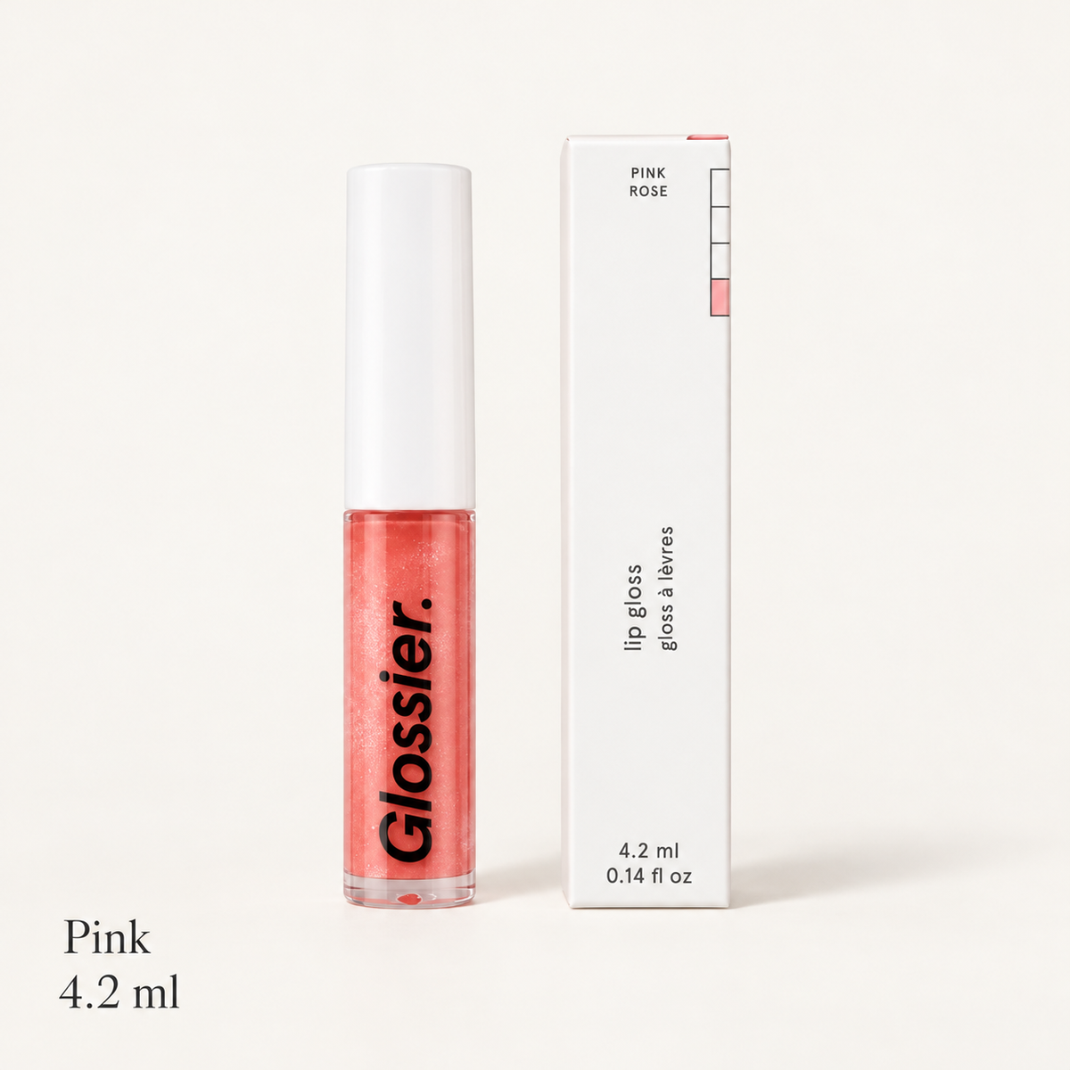 Glossier Lip Gloss Pink Rose - błyszczyk w tubce z białą nakrętką obok białego pudełka z napisem PINK ROSE i oznaczeniem 4.2 ml, na jasnym tle | Ellemania