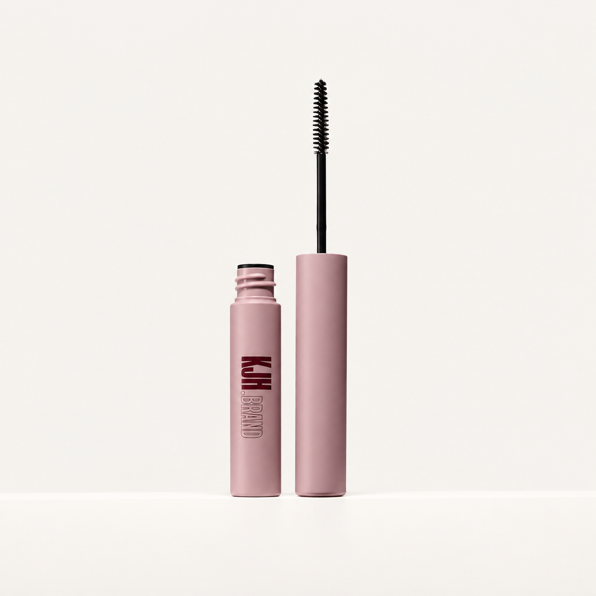 KJH.brand Nano Set Brow Gel Clear - pudroworóżowa tubka z otwartą nakrętką i wąską szczoteczką spiralną | Ellemania